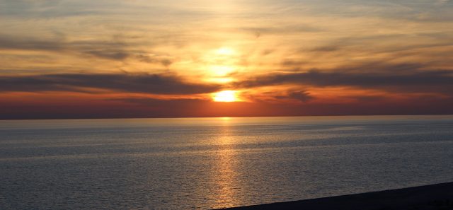 Sun sets over Lake Michigan at Miniwanca beach