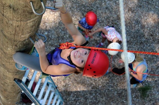 Piper climbs to top of high ropes course
