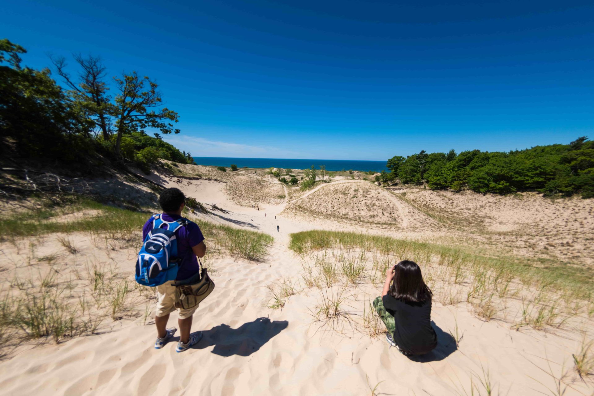 Camp Miniwanca staff and student look at Lake Michigan from top of dune- photo courtesy Dan Terpstra-min