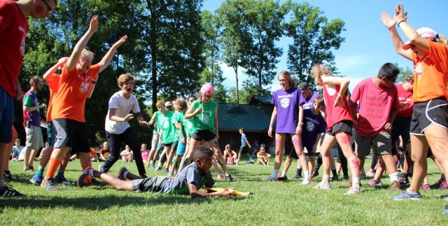 Miniwanca early bird summer campers cheer during steal the bacon